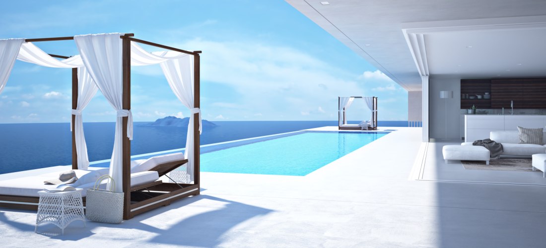 Luxuriöse Villa mit offenem Wohnbereich und großem Infinity-Pool, der in den Horizont über dem Meer zu fließen scheint. Weiße Himmelbetten mit Vorhängen stehen am Beckenrand. Im Hintergrund ist eine kleine Insel zu sehen, der Himmel ist klar und blau